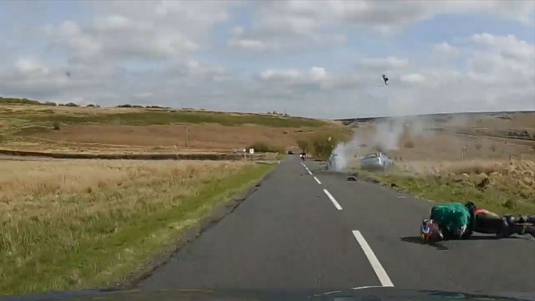 Grab taken from dashcam footage issued by South Yorkshire Police of a motorcyclist after crashing head on into a car