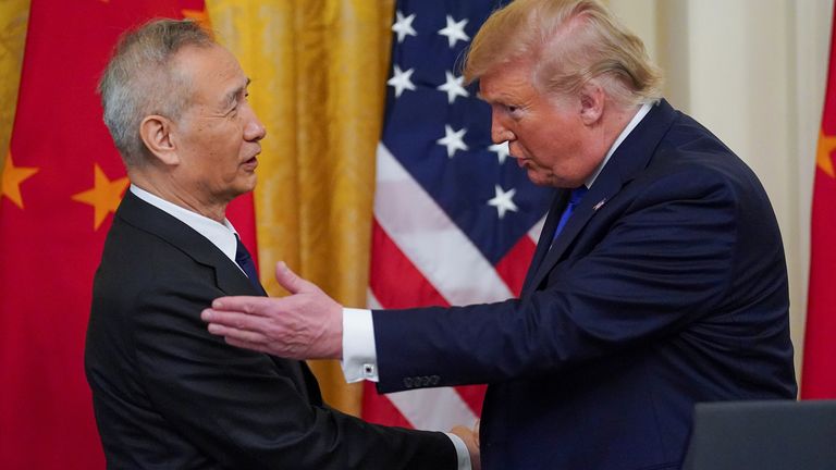 U.S. President Donald Trump greets Chinese Vice Premier Liu He prior to signing "phase one" of the U.S.-China trade agreement with Liu in the East Room of the White House