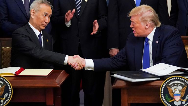 Chinese Vice Premier Liu He and U.S. President Donald Trump shake hands after signing "phase one" of the U.S.-China trade agreement during a ceremony in the East Room of the White House 