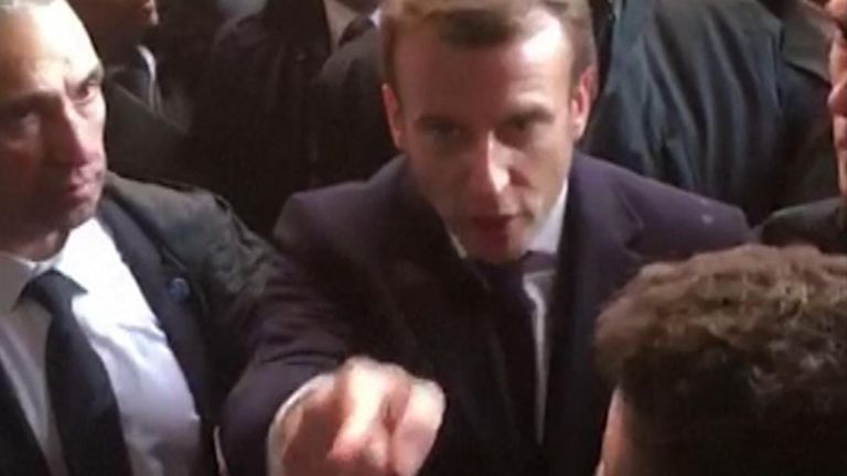 In the video, French President Emmanuel Macron asks a security guard to &#34;go outside&#34;.