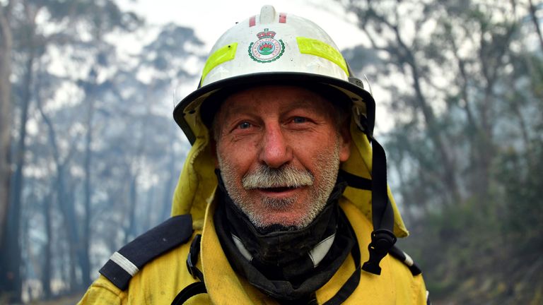 This photo taken on December 18, 2019 shows volunteer firefighter Gary Stokes monitoring bushfires close to the residential area in Dargan, some 120 kilometres from Sydney