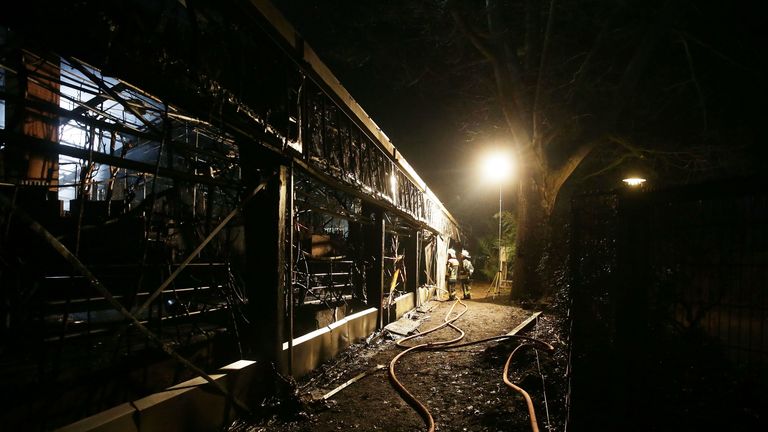 Firemen work at the burned-out monkey house of the zoo in Krefeld, western Germany, on early January 1, 2020. - Fire ripped through the monkey house at Krefeld zoo on New Year&#39;s Eve, killing dozens of animals, including orangutans, chimpanzees and marmosets, the management said. (Photo by David Young / DPA / AFP) / Germany OUT (Photo by DAVID YOUNG/DPA/AFP via Getty Images)
