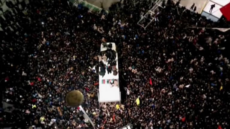 Tens of thousands of people in the northeastern city of Mashhad watched Soleimani&#39;s body being transported by truck to Imam Reza shrine during Sunday&#39;s funeral procession.