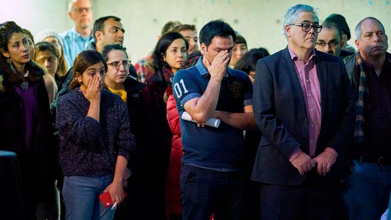 People attend a memorial service at Western University in London, Ontario, for the four graduate students who were killed in a plane crash in Iran