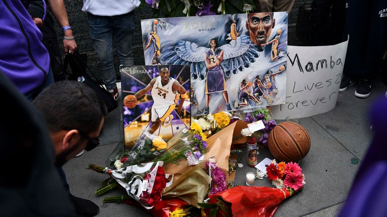 Fans mourn the loss of the NBA legend outside the Staples Center in Los Angeles