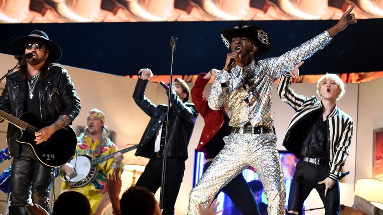  Billy Ray Cyrus, Lil Nas X, and BTS perform at the 62nd Annual GRAMMY Awards on January 26, 2020 in Los Angeles, California