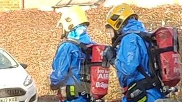 Firefighters were seen in hazmat suits. Pic: Jim Hutton