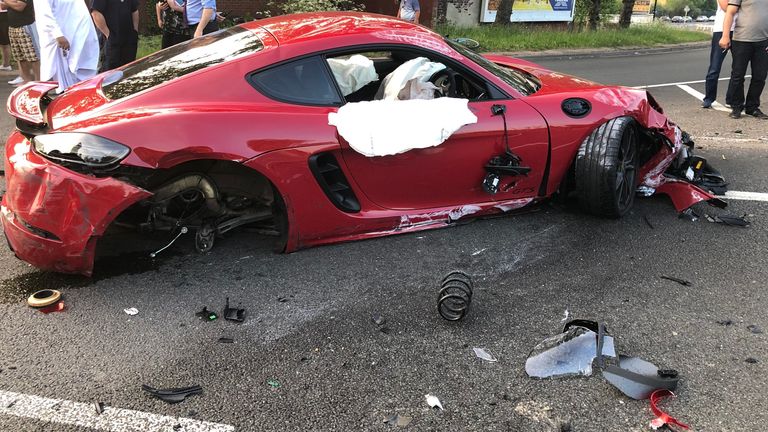 The smashed up ref Porsche after the crash