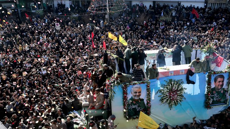 Iranian people attend a funeral procession and burial for Iranian Major-General Qassem Soleimani