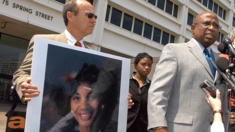 John Hawthorne, right, widower of Alice Hawthorne, the woman killed in the 27 July 1996 Centennial Olympic Park explosion, speaks after Eric Rudolph was sentenced to life in prison for three Atlanta bombings. Alice Hawthorne&#39;s daughter is to the left of Hawthorne