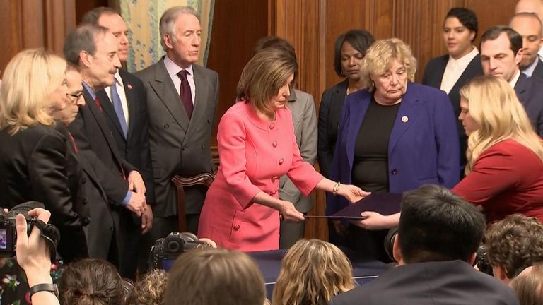 Nancye Pelosi signs article of impeachment against president Trump