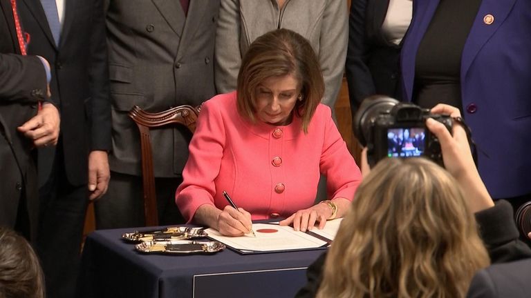 Nancy Pelosi signs article of impeachment against president Trump