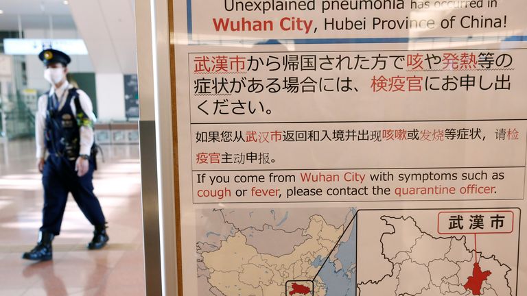 Signs at Tokyo&#39;s Haneda airport told passengers who had been to Wuhan to make themselves known