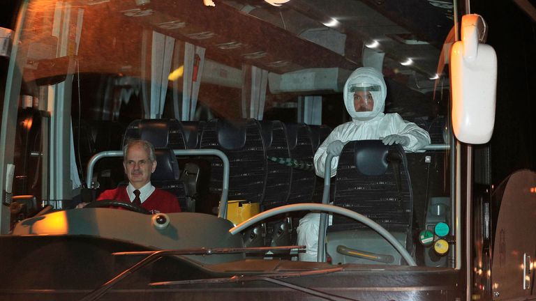 A medic wearing a white specialist suit was sat next to the coach driver of each vehicle