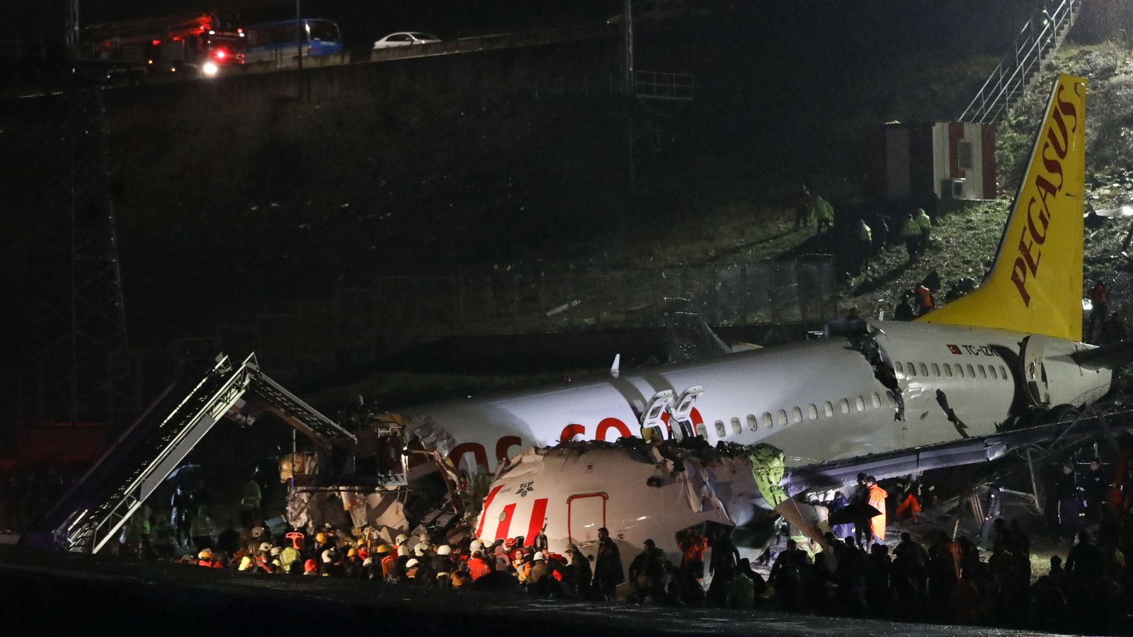 Plane splits in three after skidding off runway, leaving three dead and ...