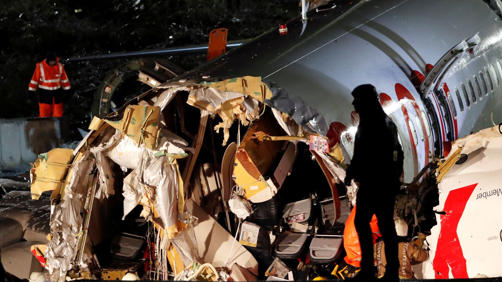 Plane splits in three after skidding off runway, leaving three dead and ...
