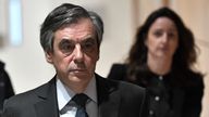 Former French prime minister Francois Fillon (R) and his wife Penelope (L) arrive at Paris courthouse for their trial on February 24, 2020. - Francois Fillon goes on trial over claims he embezzled more than a million euros in public funds by creating a fake job for his wife, a scandal that cost him his shot at the French presidency in 2017. 