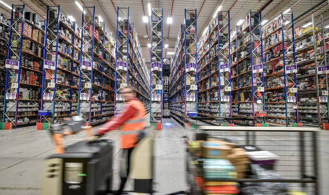 Amazon to help UK business reopen as its US employees take legal action over COVID measures