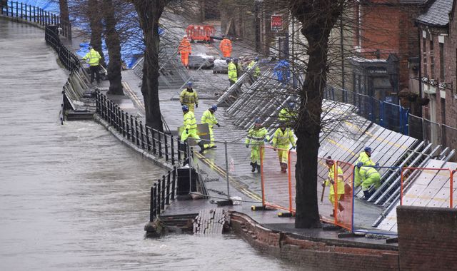 UK weather: Storm Jorge forces flood-hit towns to put up temporary barriers