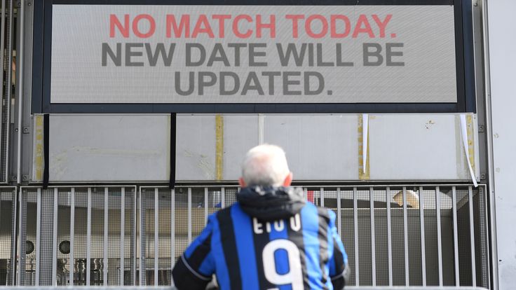 A man stands outside the San Siro stadium after the Inter Milan v Sampdoria Serie A match was cancelled due to an outbreak of the coronavirus in Lombardy and Veneto, in Milan, Italy, February 23, 2020