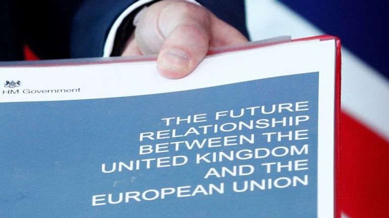 Britain's Secretary of State for Exiting the European Union, Dominic Raab, holds documents as he poses with European Union's chief Brexit negotiator, Michel Barnier, ahead of a meeting in Brussels, Belgium July 19, 2018.   REUTERS/Francois Lenoir