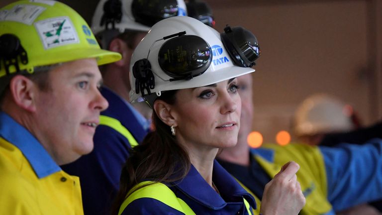 The Duchess of Cambridge inspects operations with works manager Carl Banfield at the control centre during a visit to Tata Steel in Port Talbot in south Wales.