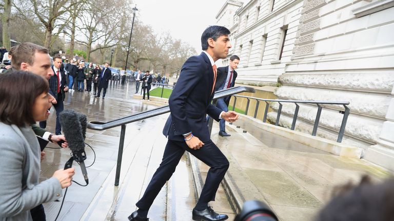 Newly installed Chancellor of the Exchequer Rishi Sunak arrives at the Treasury in London.