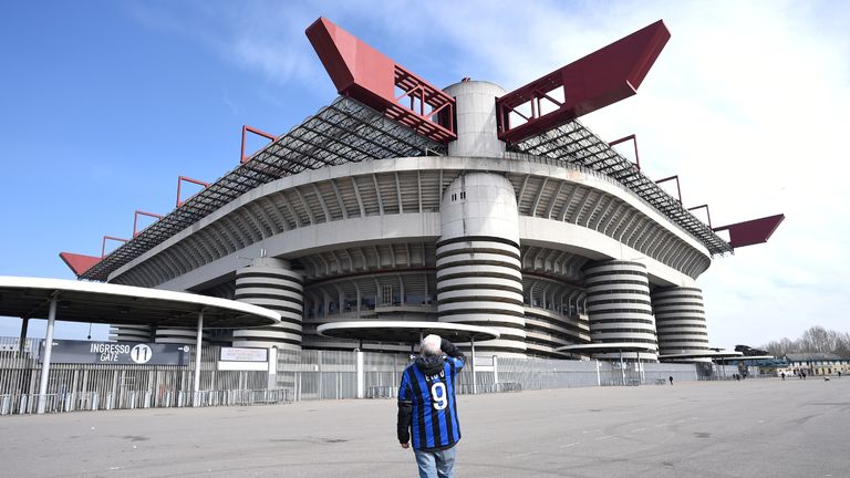 A man stands outside the San Siro stadium after the Inter Milan v Sampdoria Serie A match was cancelled due to an outbreak of the coronavirus in Lombardy and Veneto, in Milan, Italy, February 23, 2020.REUTERS/Daniele Mascolo