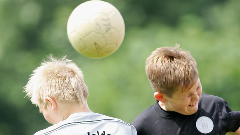 HAMBURG, GERMANY - JUNE 23:  Boys from the 9-11 year old age group go up for a header during the (DFB) German Football Association&#39;s E-Youth children&#39;s soccer tournament on June 23, 2007 in Hamburg, Germany.  (Photo by Martin Rose/Bongarts/Getty Images)