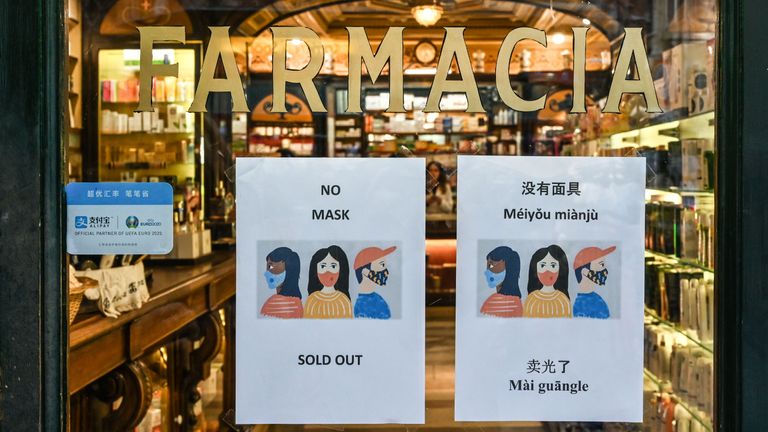A sign advising clients in various languages, including Chinese, that respiratory masks are sold out, is displayed on January 29, 2020 at a pharmacy in downtown Rome, in the wake of the 2019-nCoV coronavirus, a virus similar to the SARS pathogen, spreading around the world since emerging in a market in the central Chinese city of Wuhan. - The Italian government said on January 29, 2020 it was sending a plane to evacuate citizens from the Chinese city of Wuhan, the epicentre of a deadly SARS-like virus, as WHO chief called new emergency talks on the virus situation. (Photo by Alberto PIZZOLI / AFP) (Photo by ALBERTO PIZZOLI/AFP via Getty Images)