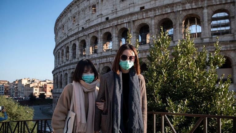 ROME, ITALY - FEBRUARY 24: Tourists wearing face masks visit the Colosseum area on February 24, 2020 in Rome, Italy. The Italian government declared a state of emergency on January 31 and today the coronavirus (Covid-19) has claimed its sixth victim in Italy, an 80-year-old man from Castiglione d'Adda who died in Milan's Sacco Hospital. (Photo by Antonio Masiello/Getty Images)