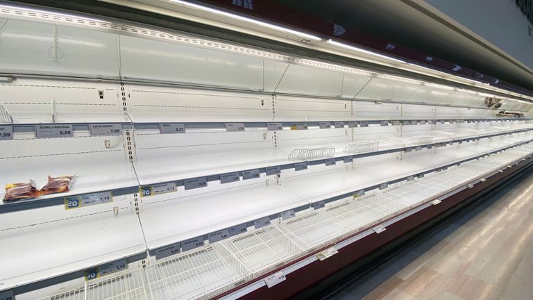 Empty shelves are seen at a supermarket, after a coronavirus outbreak, in Pioltello, near Milan, Italy, February 24, 2020. REUTERS/Flavio Lo Scalzo