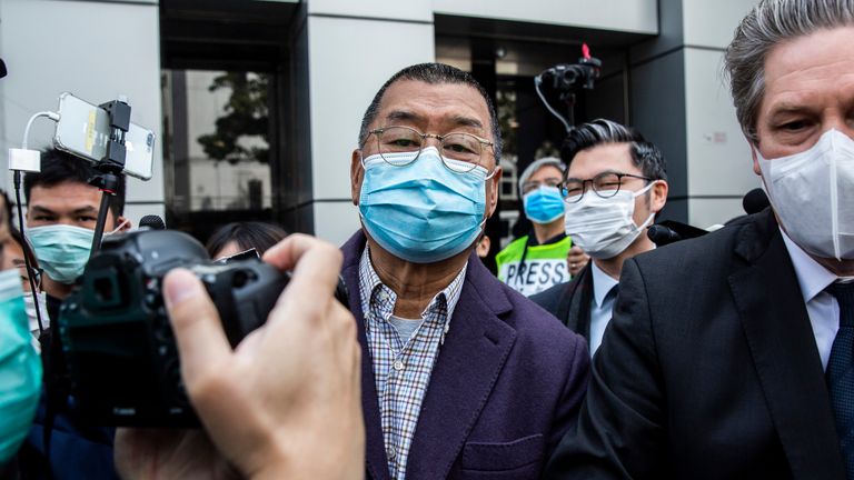 Hong Kong media tycoon and founder of Apple Daily newspaper Jimmy Lai (C) leaves the Kowloon City police station in Hong Kong on February 28, 2020, after being arrested on the suspicion of taking part in an unauthorised assembly on August 31 last year. - Hong Kong media tycoon Jimmy Lai, a high profile critic of Beijing, was arrested on February 28 for taking part in last year's pro-democracy protests that rocked the city for seven months. (Photo by ISAAC LAWRENCE / AFP) (Photo by ISAAC LAWRENCE/AFP via Getty Images)
