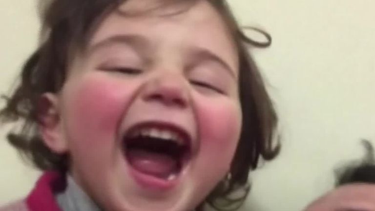 Syrian dad teaches daughter how to cope with bombs - with laughter