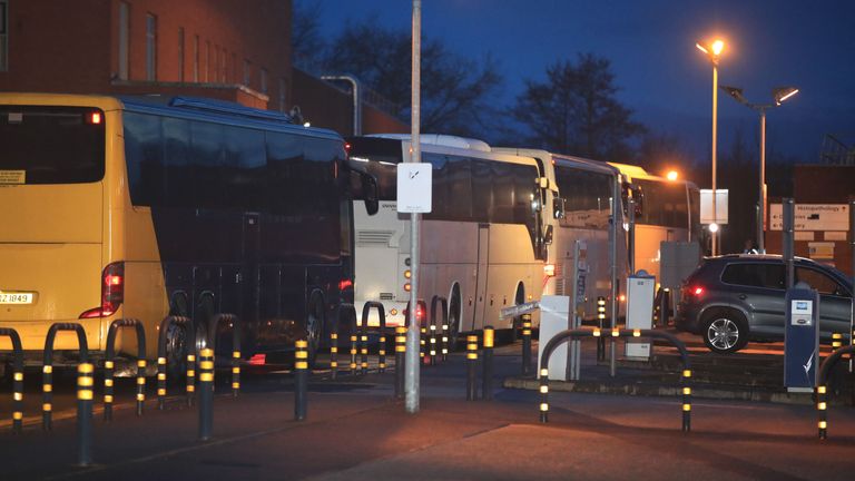 The coaches carrying cruise ship passengers arrive at Arrowe Park Hospital