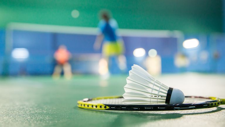 badminton courts with players competing