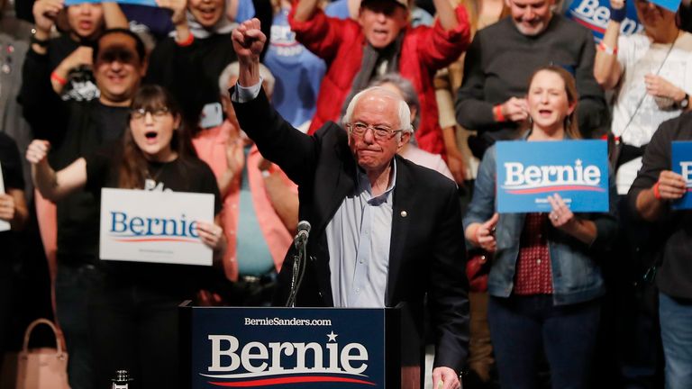 Senator Bernie Sanders thrusts his fist in the air during his first campaign rally after the Nevada Caucus