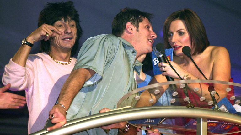 Brandon Block walks on stage to have a word with the ceremony&#39;s host Davina McCall, and interrupting Rolling Stones guitarist Ronnie Wood in 2000