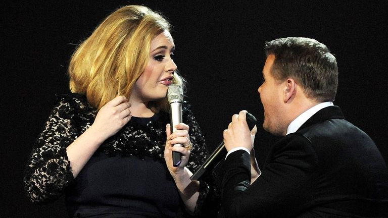 Adele is interrupted by James Corden while accepting her award in 2012. Pic: Dave M. Benett/Getty Images