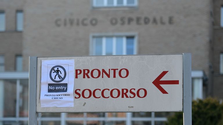 A sign reading "Emergency Department Closed" at the entrance to a hospital in Codogno