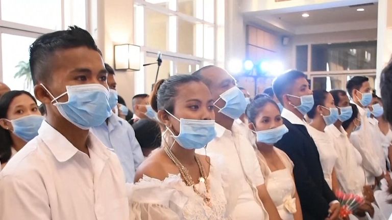 Hundreds of couples wearing facemasks tied the knot at a mass wedding in the Philippines on Thursday amid the threat of the COVID-19 disease.