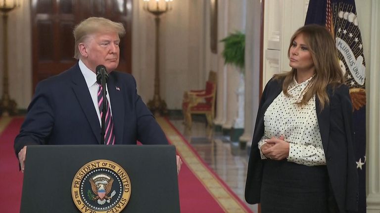 The first lady stood next to the president towards the end of his speech