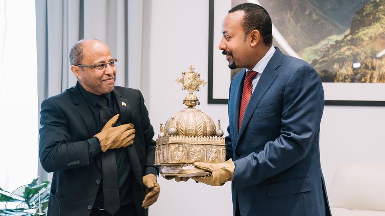 Ethiopia's Prime Minister Abiy Ahmed (right) receives the crown. Pic: @PMEthiopia