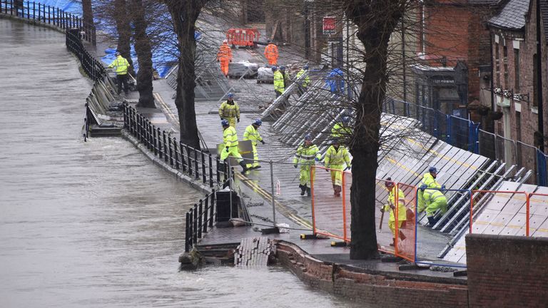 Environment Agency teams work on temporary flood barriers in the Wharfage area of Ironbridge, Shropshire, after floodwaters receded following an emergency evacuation of some properties earlier this week. PA Photo. Picture date: Friday February 28, 2020. See PA story WEATHER Storm. Photo credit should read: Matthew Cooper/PA Wire