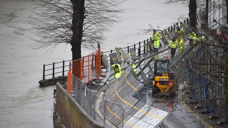 Environment Agency teams work on temporary flood barriers in the Wharfage area of Ironbridge, Shropshire, after floodwaters receded following an emergency evacuation of some properties earlier this week. PA Photo. Picture date: Friday February 28, 2020. See PA story WEATHER Storm. Photo credit should read: Matthew Cooper/PA Wire