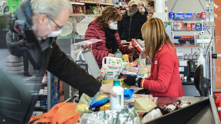 Residents shop in a supermarket in small groups of forty people on February 23, 2020 in the small Italian town of Casalpusterlengo