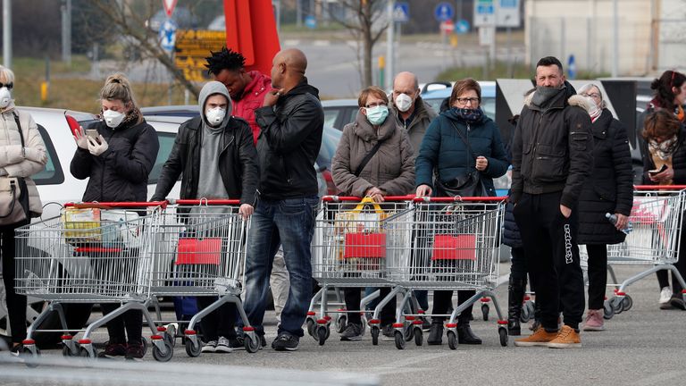 People queue at a supermarket outside the town of Casalpusterlengo, which has been closed by the Italian government due to a coronavirus outbreak in northern Italy, February 23, 2020