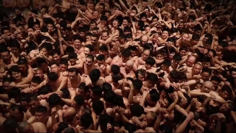 About 10,000 Japanese men clad only in loincloths braved freezing temperatures to pack into a temple at the weekend and scramble in the dark for lucky wooden talismans tossed into the crowd, in a ritual that dates back more than 500 years.