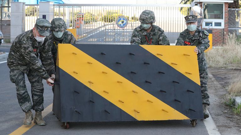 South Korean marines placed a barricade at the entrance of a navy base in Jeju Island after a marine contracted COVID-19