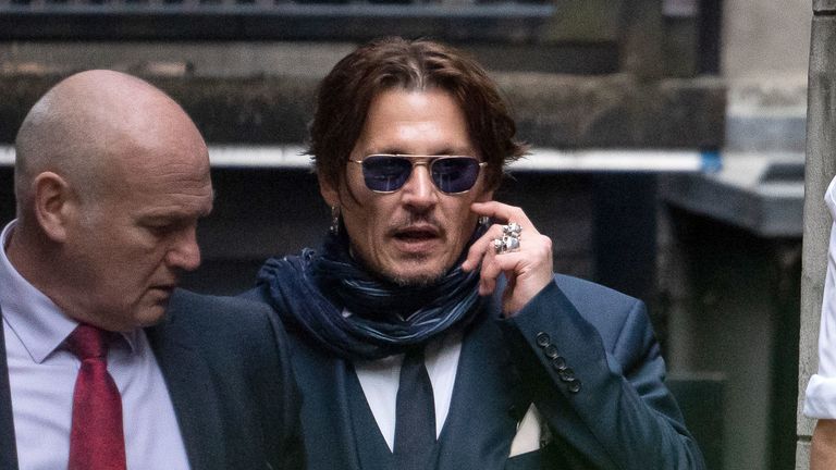 Johnny Depp (right) outside the High Court for a hearing in his libel case against the publishers of The Sun and its executive editor, Dan Wootton